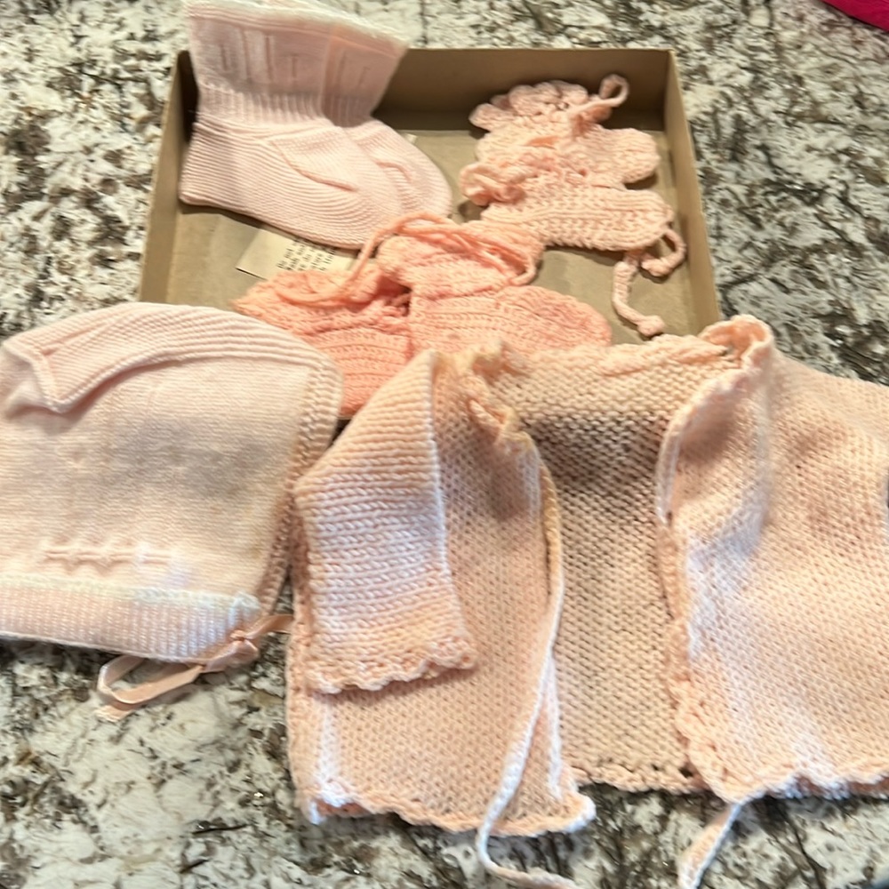Knit cap and booties with handmade sweater all crocheted by someone local